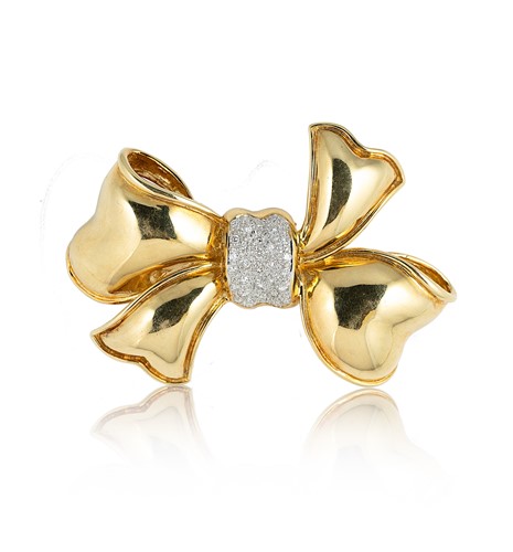 Lot 54 - A diamond set bow brooch