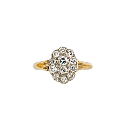 Lot 93 - An 18ct gold oval shaped diamond cluster ring