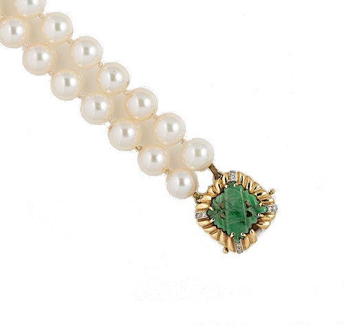 Lot 38 - A double row cultured pearl choker with a jade clasp
