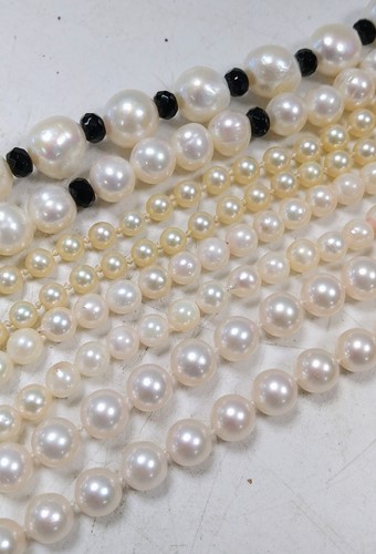 Lot 324 - Three cultured pearl necklaces, together with...