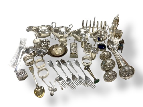 Lot 295 - A collection of silverware including sauce...