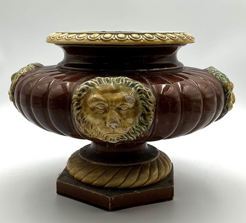 Lot 49 - A Continental majolica plant stand with lions...