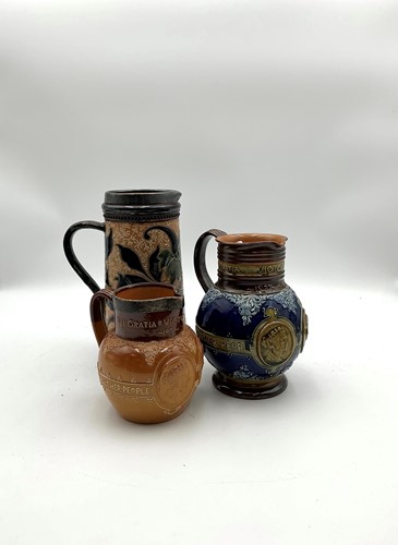 Lot 5 - A Doulton jug with silver rim and two other...