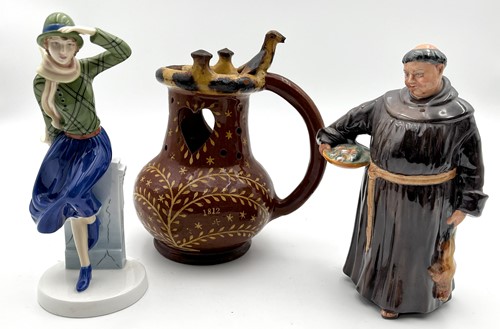 Lot 34 - A 19th century pottery slipware puzzle jug...