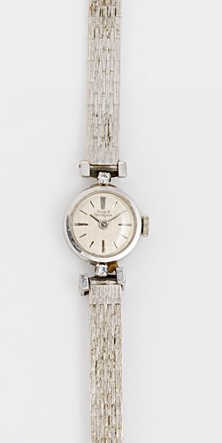 Lot 254 - Girard Perregaux - An 18ct gold diamond set wristwatch