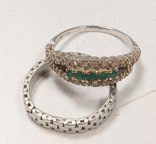 Lot 331 - An emerald and diamond ring, tested as 18ct...