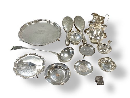 Lot 281 - A collection of silverware including waiters,...