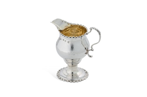 Lot 389 - A George III 18th century silver cream jug