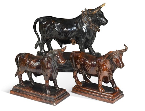 Lot 390 - A large Portuguese Caldas pottery brown glazed model of a bull, late 19th century