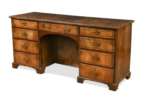 Lot 440 - A walnut kneehole desk, mid-18th century and later