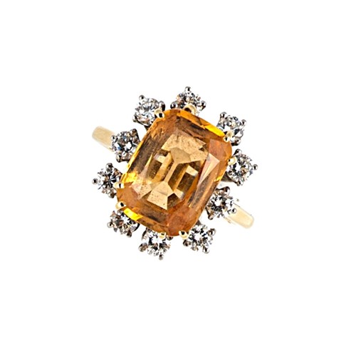 Lot 177 - An imperial topaz and diamond cluster ring