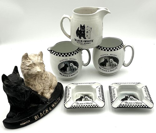 Lot 77 - A quantity of Black and White whisky ceramics,...