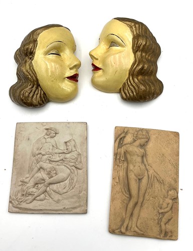 Lot 30 - A pair of Art Deco ceramic faces; together...
