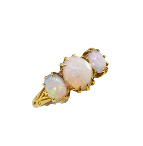 Lot 67 - A three stone opal ring