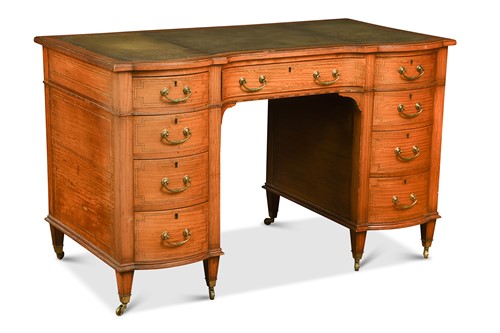 Lot 617 - A Sheraton style satinwood kneehole desk, circa 1900