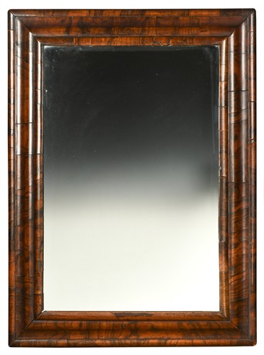 Lot 417 - An olivewood cushion moulded wall mirror, early 18th century