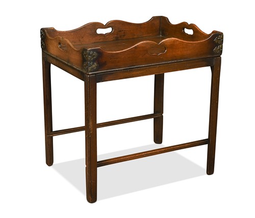 Lot 580 - A George III mahogany butler’s tray on a later stand