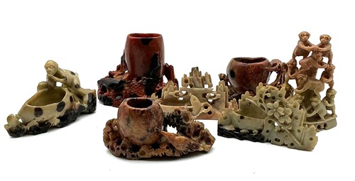 Lot 8 - A collection of seven Chinese carved soapstone...