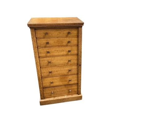Lot 603 - A Victorian blonde oak Wellington chest, top...