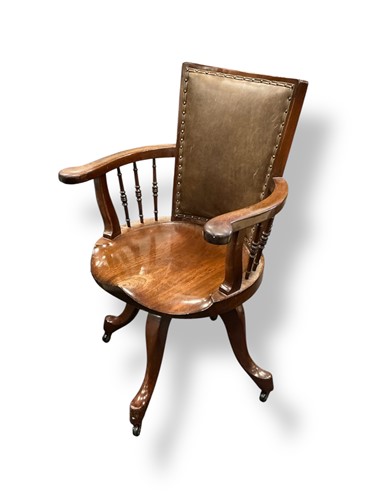 Lot 607 - An Edwardian mahogany revolving desk chair,...
