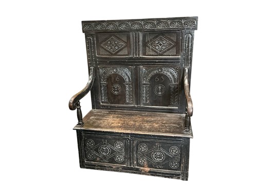 Lot 589 - A 17th century style carved oak settle, 19th...