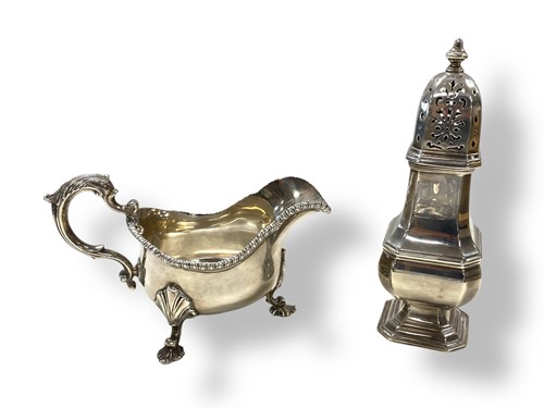 Lot 288 - A silver sauce boat together with a silver...