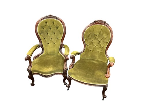 Lot 642 - A near pair of Victorian walnut button back...