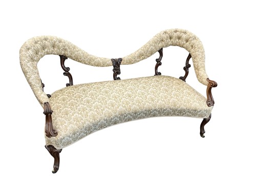 Lot 606 - A Victorian rosewood two seater camelback...