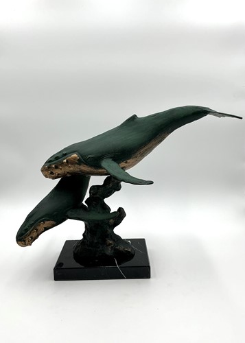 Lot 192 - A bronzed green patinated model of a pair of...