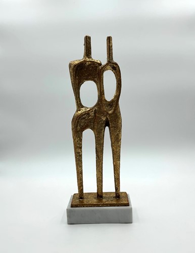 Lot 199 - A metal sculpture of a standing couple, gold...