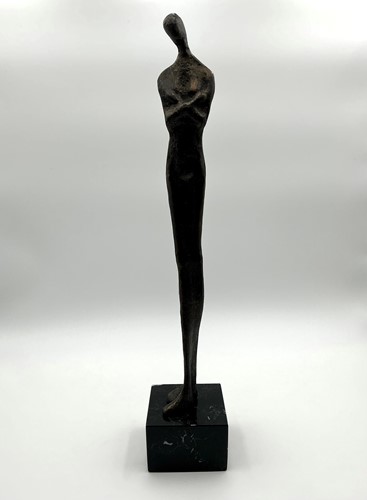 Lot 197 - A bronzed patinated sculpture of an elongated...