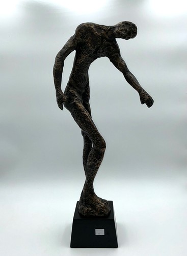 Lot 194 - A large bronzed metal sculpture of a standing...