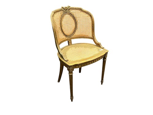 Lot 562 - A French giltwood and cane chair