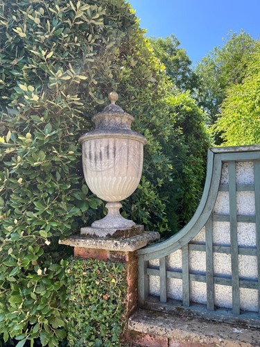 Lot 768 - A composite stone urn and cover, 20th century