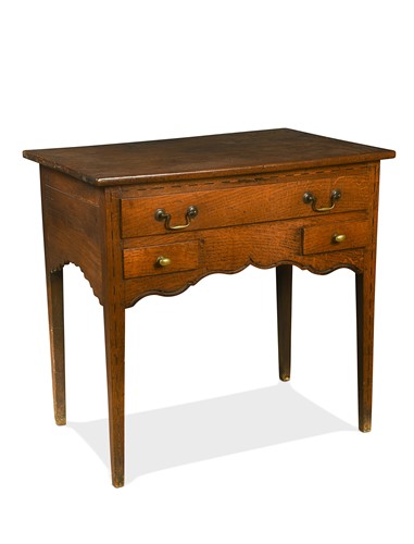 Lot 623 - A George III oak side table