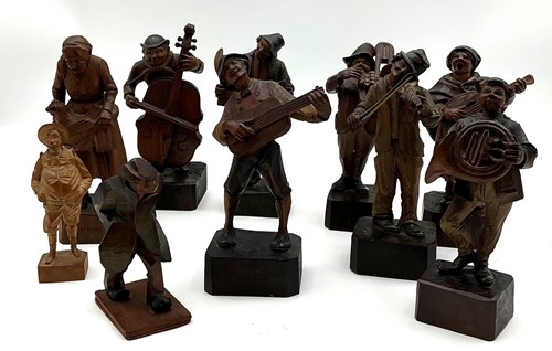 Lot 238 - Collection of carved wooden village musicians...