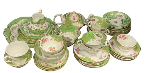 Lot 113 - A Thomas Goode floral gold and green demitasse...