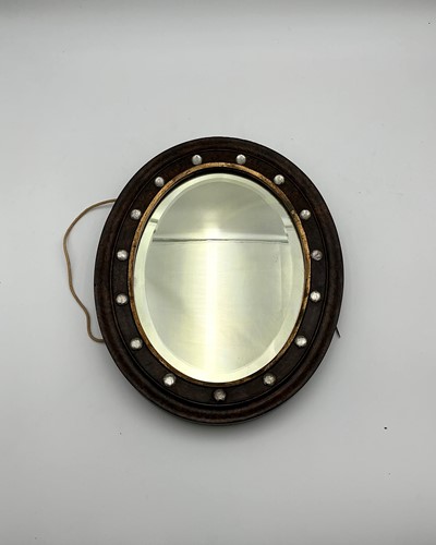 Lot 515 - A 19th century oval wall mirror with cabochons...