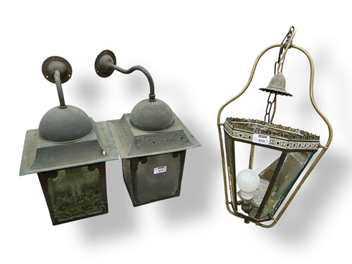 Lot 630 - A near pair of verdigris exterior wall lights,...