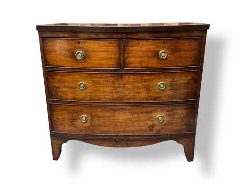 Lot 658 - A Regency mahogany bow fronted chest of...