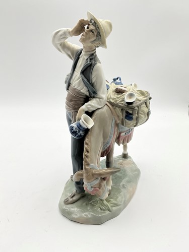 Lot 12 - Lladro figure titled the 'Typical Peddler',...