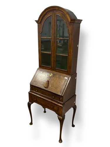Lot 696 - A George I style walnut bureau cabinet, the...