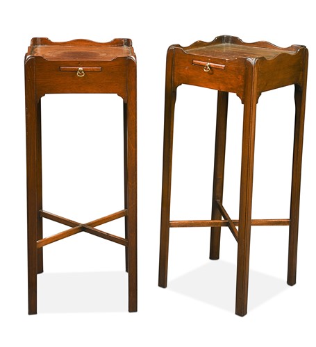 Lot 478 - A pair of George III style mahogany square urn stands