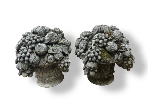 Lot 719 - A pair of composite stone garden...