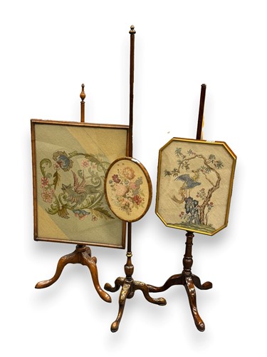 Lot 651 - Three pole screens with needlework panels;...