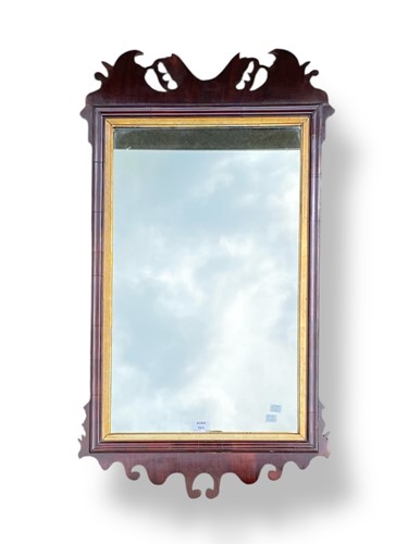 Lot 560 - A Georgian mahogany wall mirror, inset with...