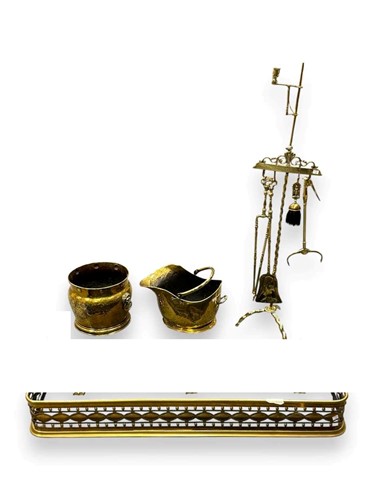 Lot 648 - One pierced brass fender, 124cm wide, together...