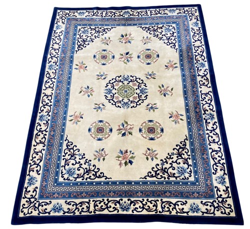Lot 723 - A 'Peking' sculpted carpet, the central cream...
