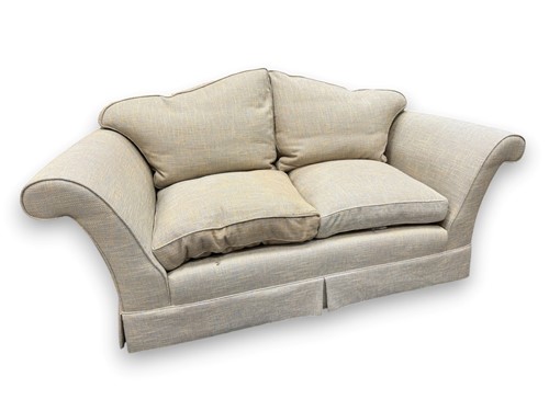 Lot 654 - A two seat sofa, modern, with arched back and...