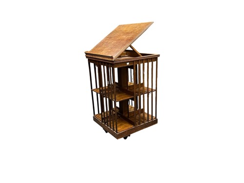 Lot 637 - A 20th century oak revolving bookcase, the...
